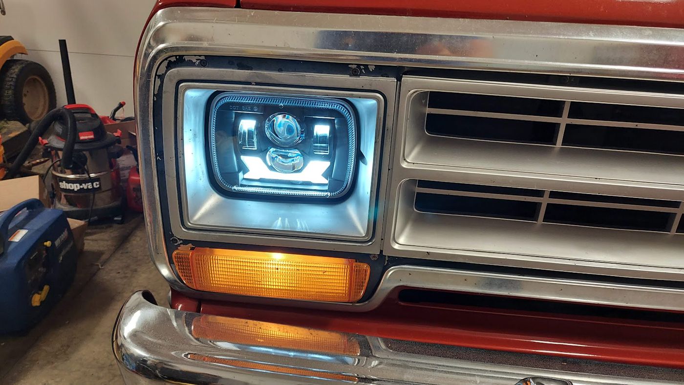Close-up of an LED headlight conversion on a classic Dodge Ramcharger
