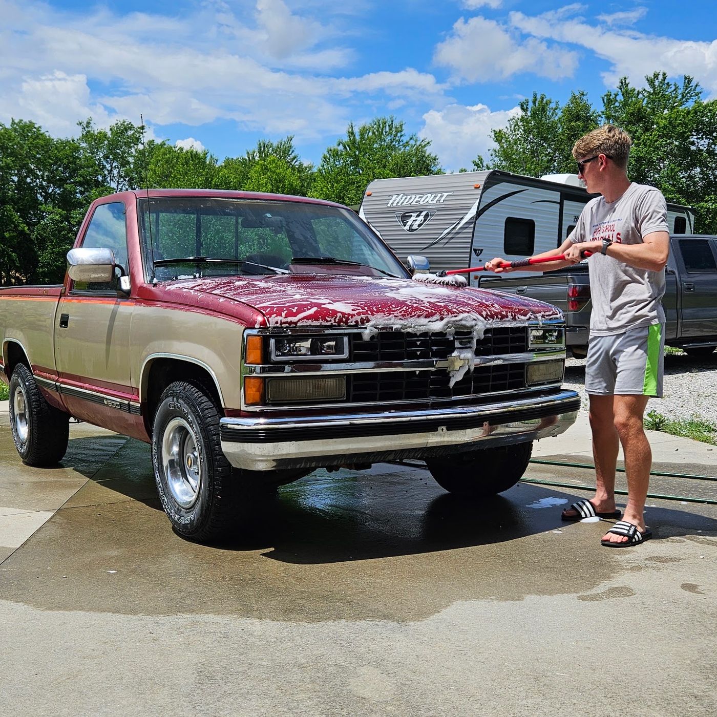 1991 Chevrolet Silverado getting washed in the driveway